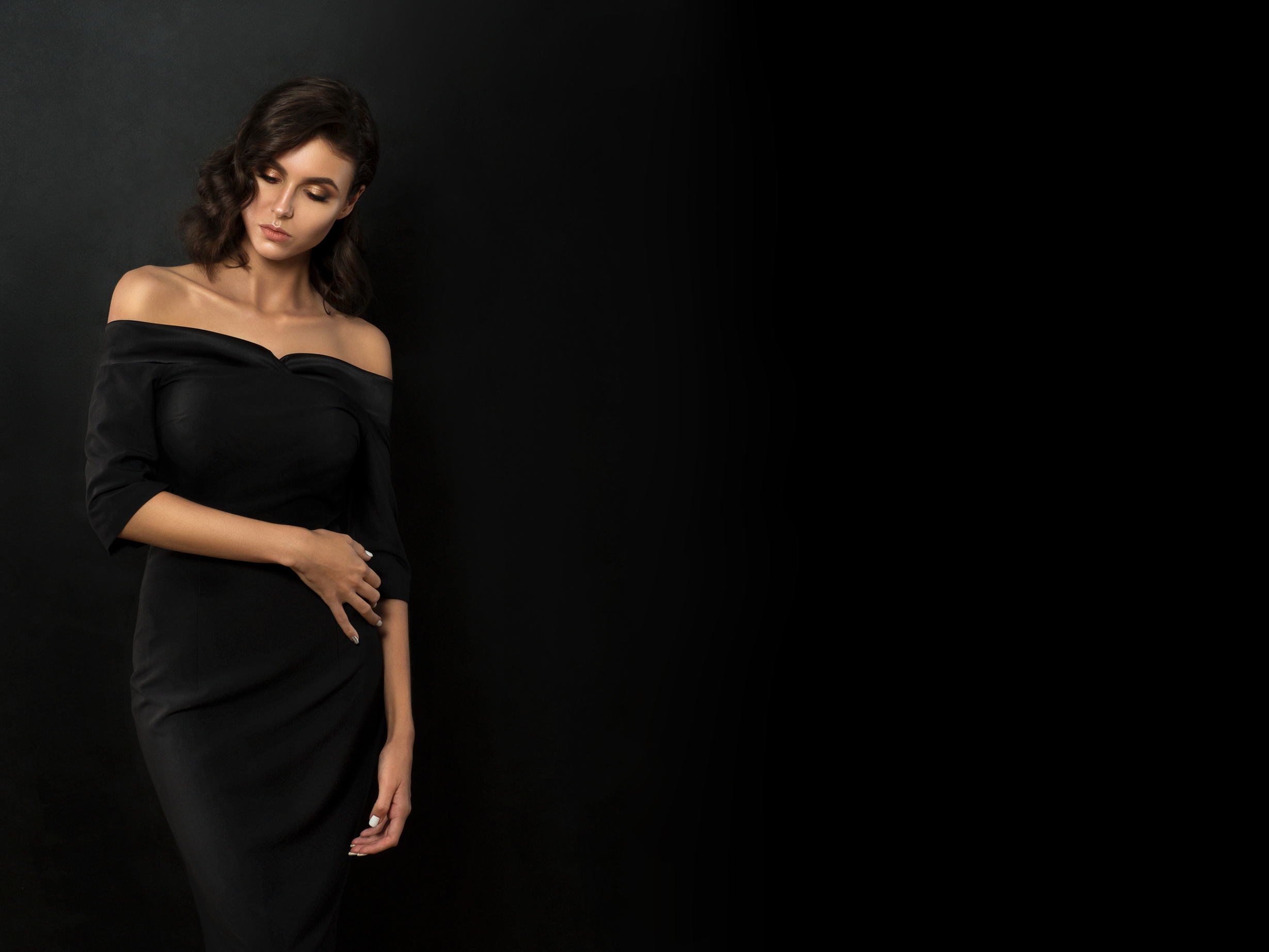 Woman Wearing a Black Dress on Black Background